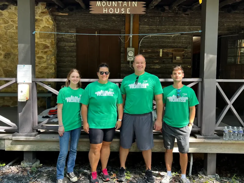 Volunteer group at camp cabin