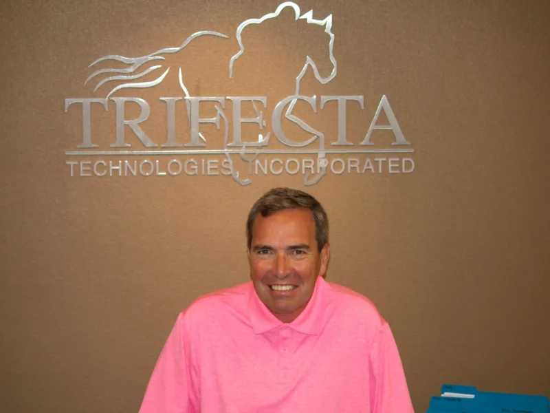 man posing with trifecta sign