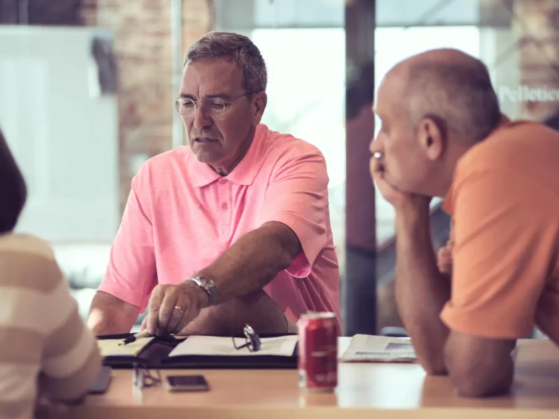 Man explaining concept to team